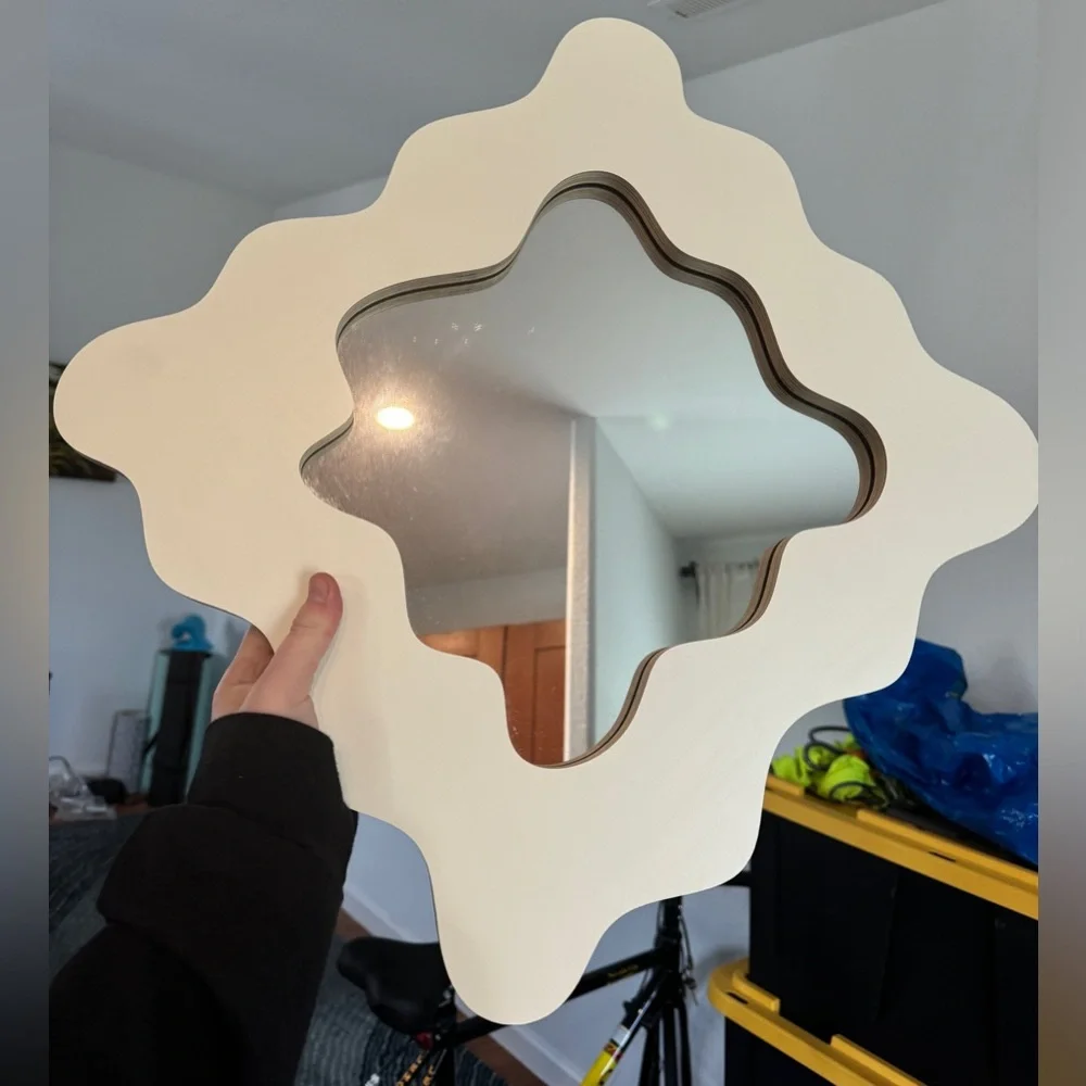 Small wavy cut mirror. Cream color. Like new.